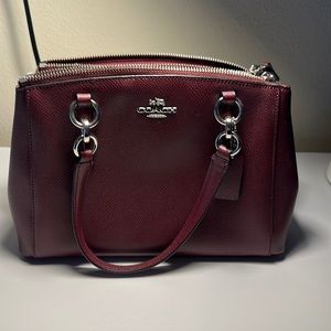 Leather Coach crossbody purse. Wine/burgundy